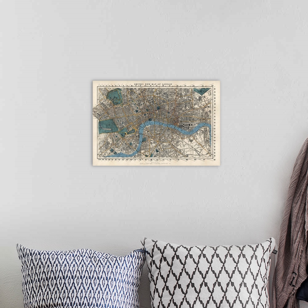 A bohemian room featuring This wall art is an aerial, hand drawn map of the city with street, building, and railway names.