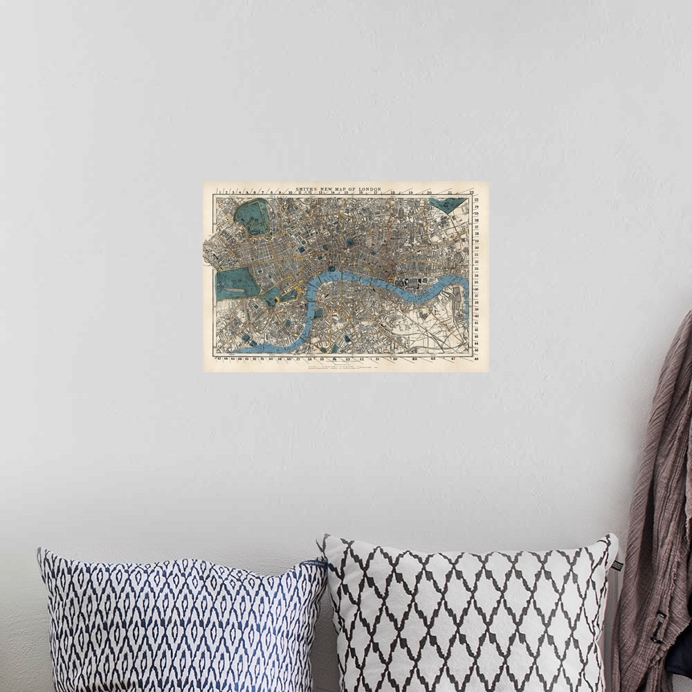 A bohemian room featuring This wall art is an aerial, hand drawn map of the city with street, building, and railway names.