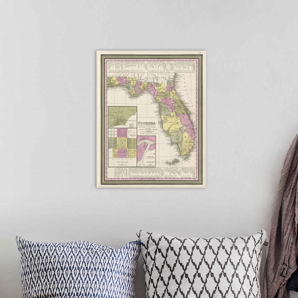 A bohemian room featuring This large piece is an antique map of the state of Florida.