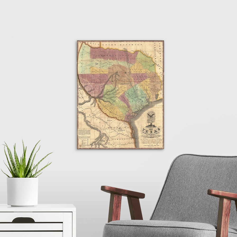 A modern room featuring This is a very old antique map of the Lone Star state in its very early history showing different...