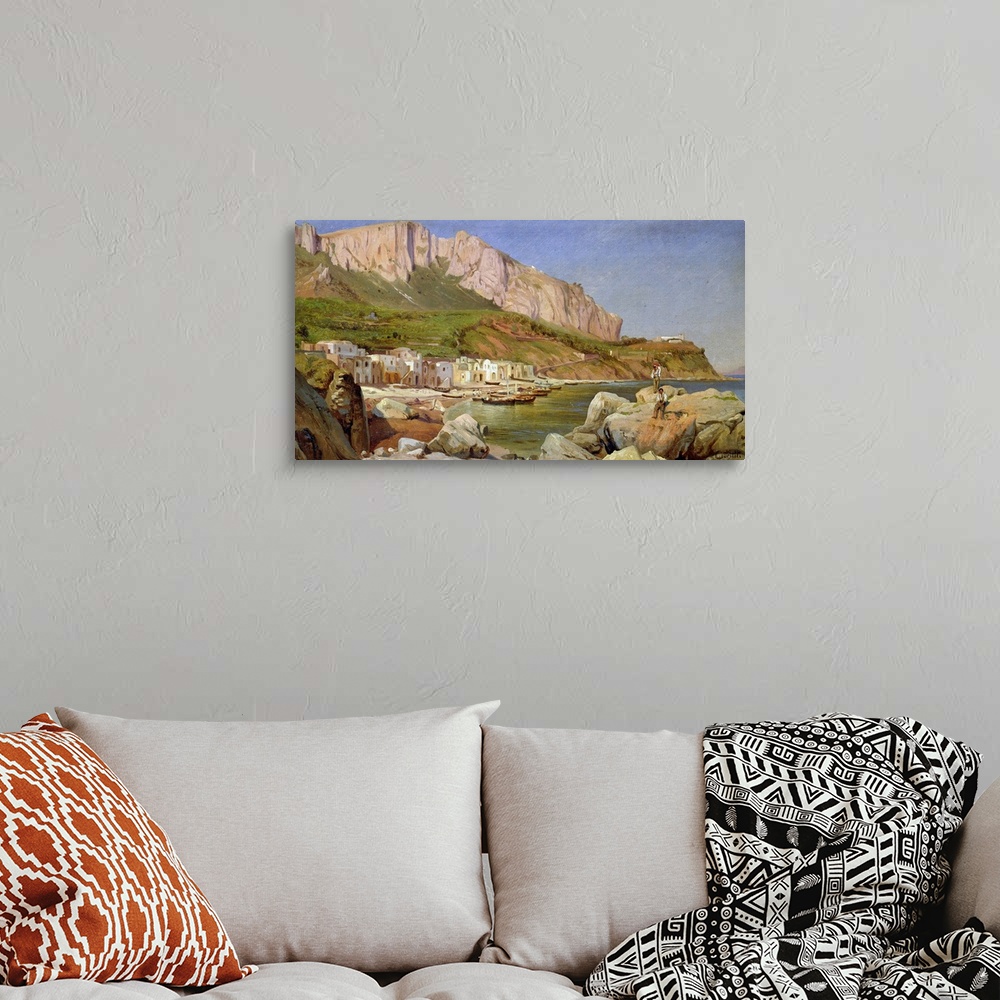 A bohemian room featuring Oil painting overlooking a small fishing village in a bay with large cliffs and rocks surrounding...