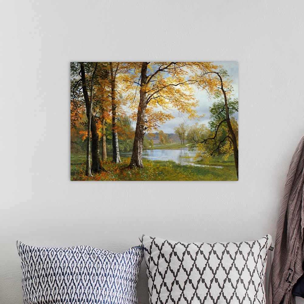 A bohemian room featuring Classic painting of a small wooded grove near a pond, the trees in autumn colors and hills in the...