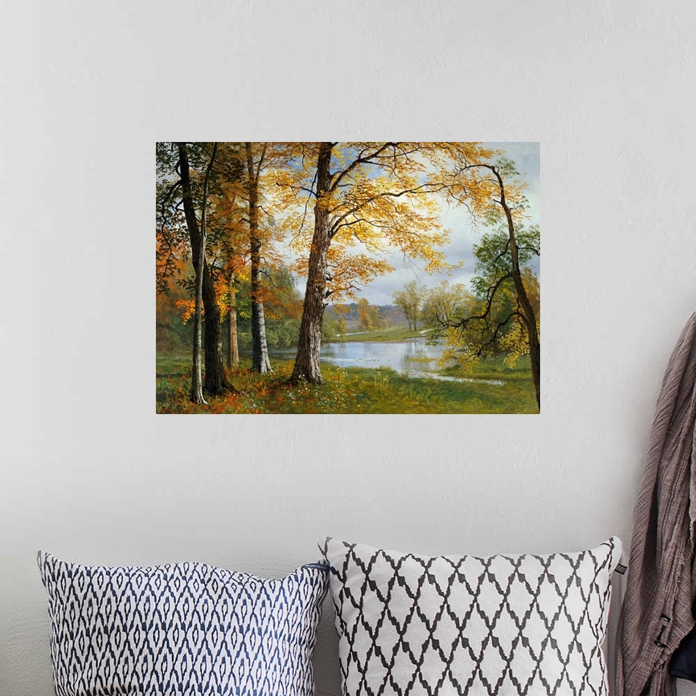 A bohemian room featuring Classic painting of a small wooded grove near a pond, the trees in autumn colors and hills in the...