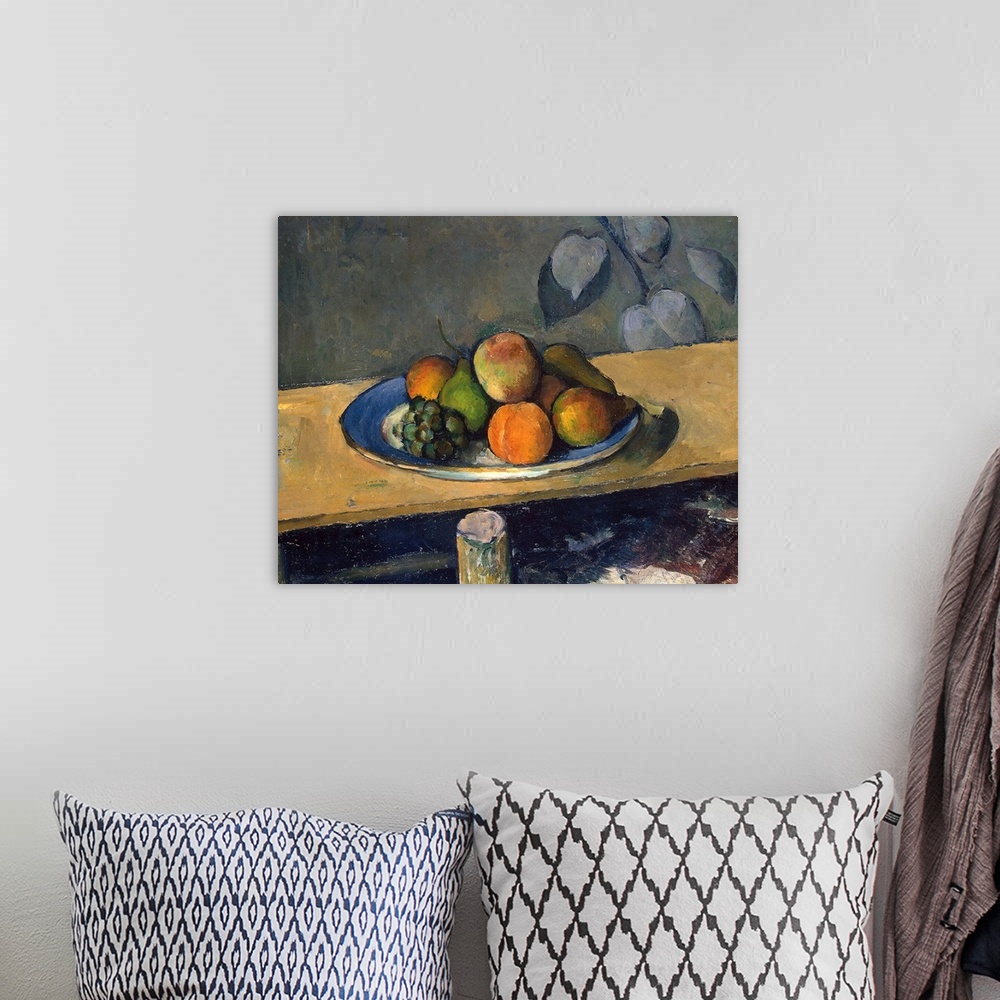A bohemian room featuring A classic artwork piece of a plate of fruit that sits atop a wooden table.