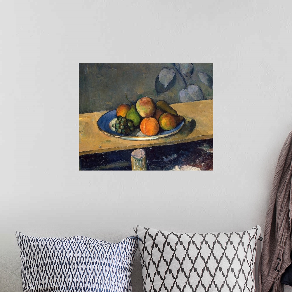 A bohemian room featuring A classic artwork piece of a plate of fruit that sits atop a wooden table.