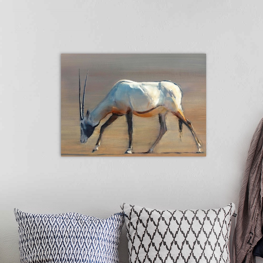 A bohemian room featuring Contemporary wildlife painting of an Oryx grazing in the desert.