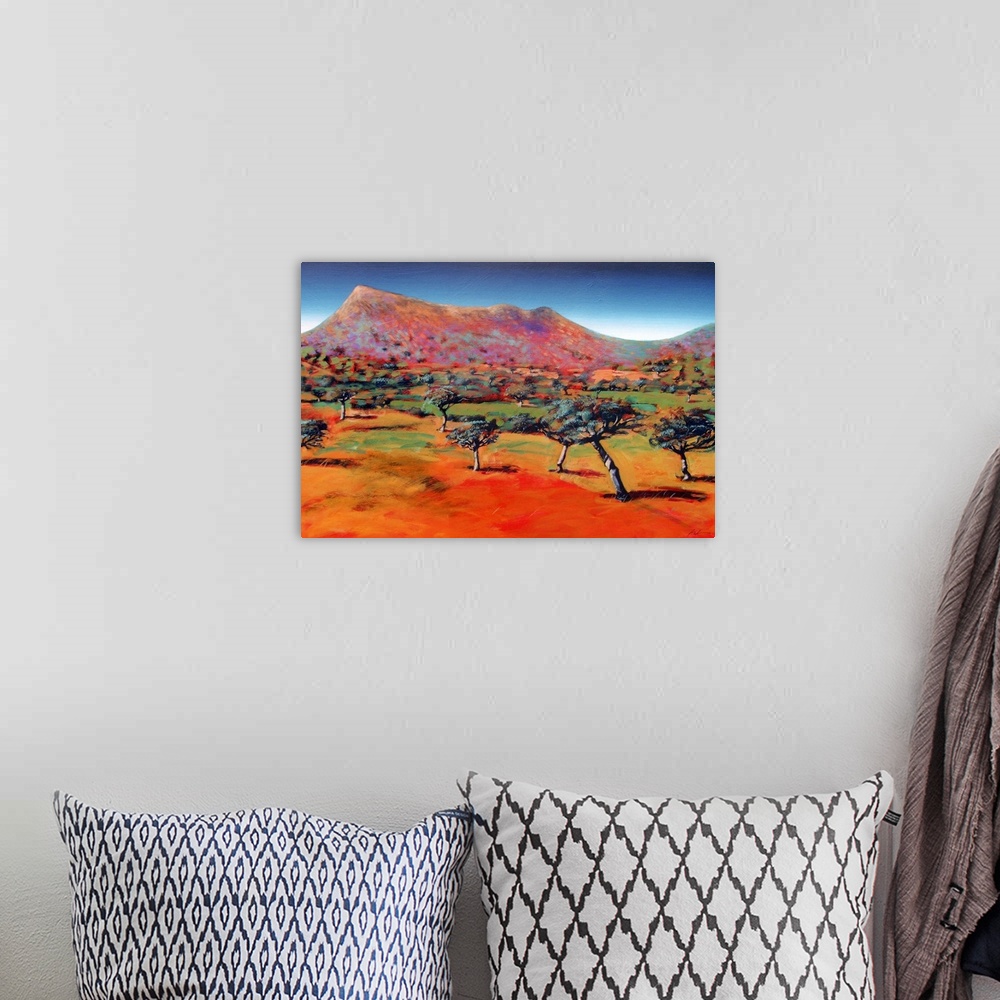 A bohemian room featuring Acrylic painting of trees randomly sticking up on the flat ground at the base of a barren mountain.