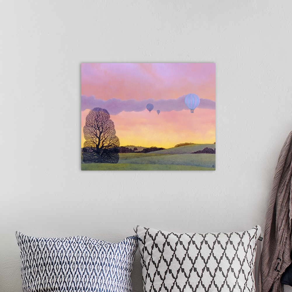A bohemian room featuring Oil painting of hot air balloons floating over tree covered rolling hills with colorful sky at su...