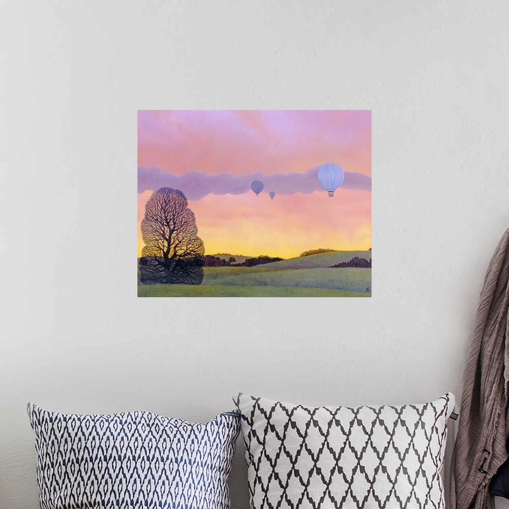 A bohemian room featuring Oil painting of hot air balloons floating over tree covered rolling hills with colorful sky at su...