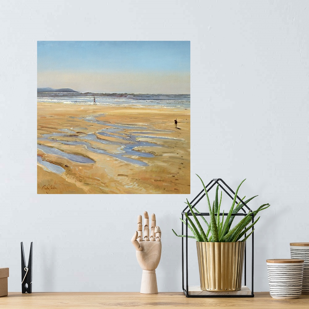 A bohemian room featuring Contemporary artwork of a person walking along the water on the beach as their dog runs toward th...