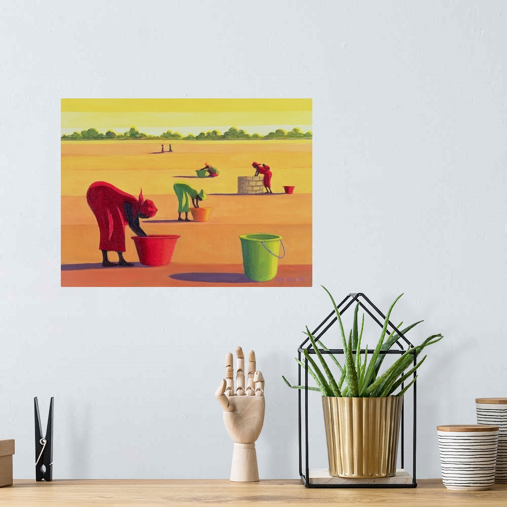 A bohemian room featuring Large artwork showing women filling buckets with water in an open desert field.