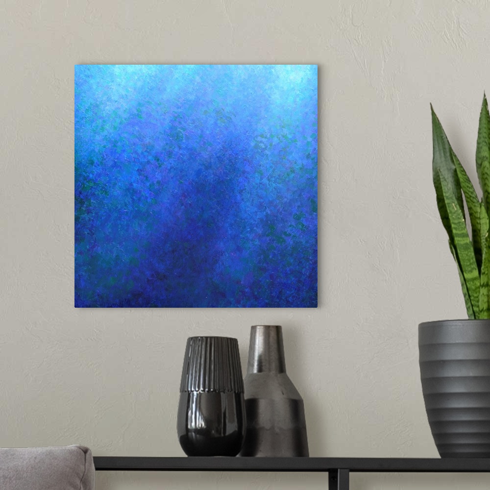 A modern room featuring Contemporary abstract painting using blue tones to create a feeling of depth.