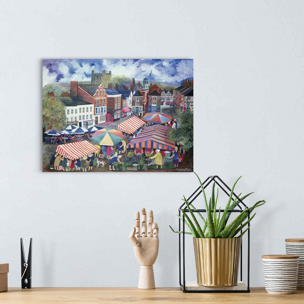 A bohemian room featuring Contemporary painting of several colorful tents at an outdoor market.