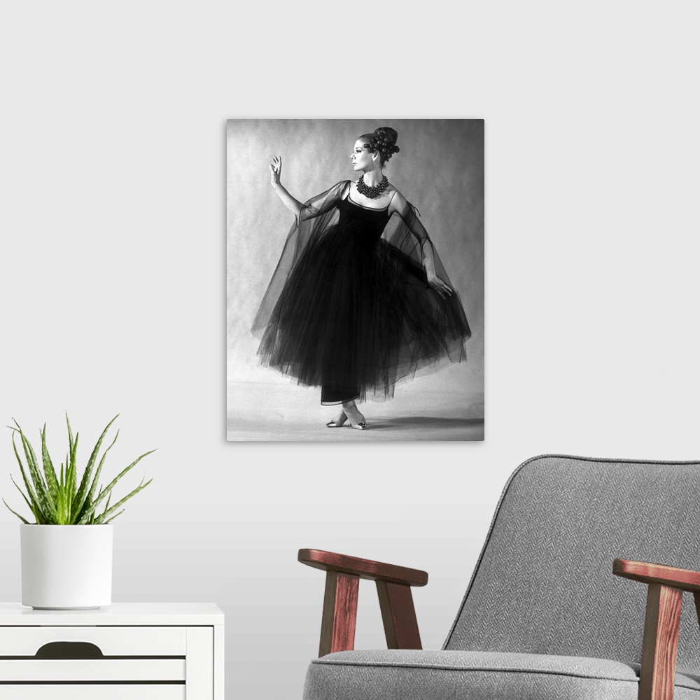 A modern room featuring Presentation on february 27, 1963 of fashion by Jacques Heim, Paris : black tulle evening dress