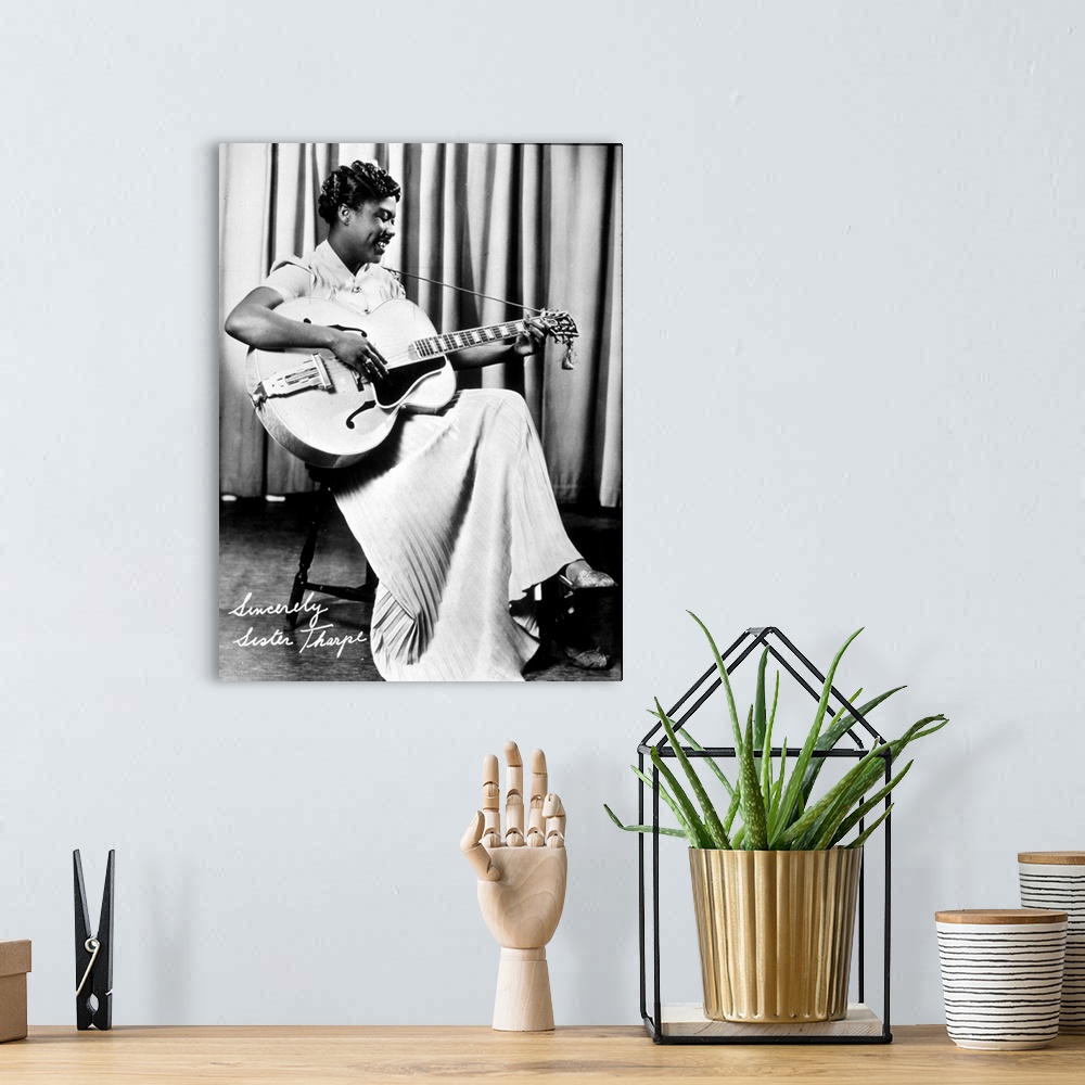 A bohemian room featuring Sister Rosetta Tharp blues guitarist and Singer, here playing steel guitar; (add.info.: Sister Ro...