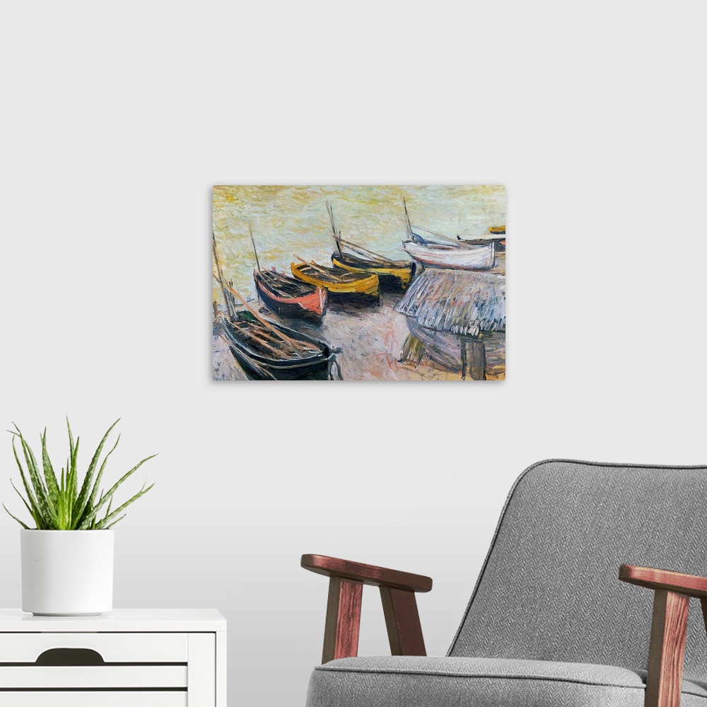 A modern room featuring Landscape, large classic painting of a line of small row boats sitting on the beach, near the wat...