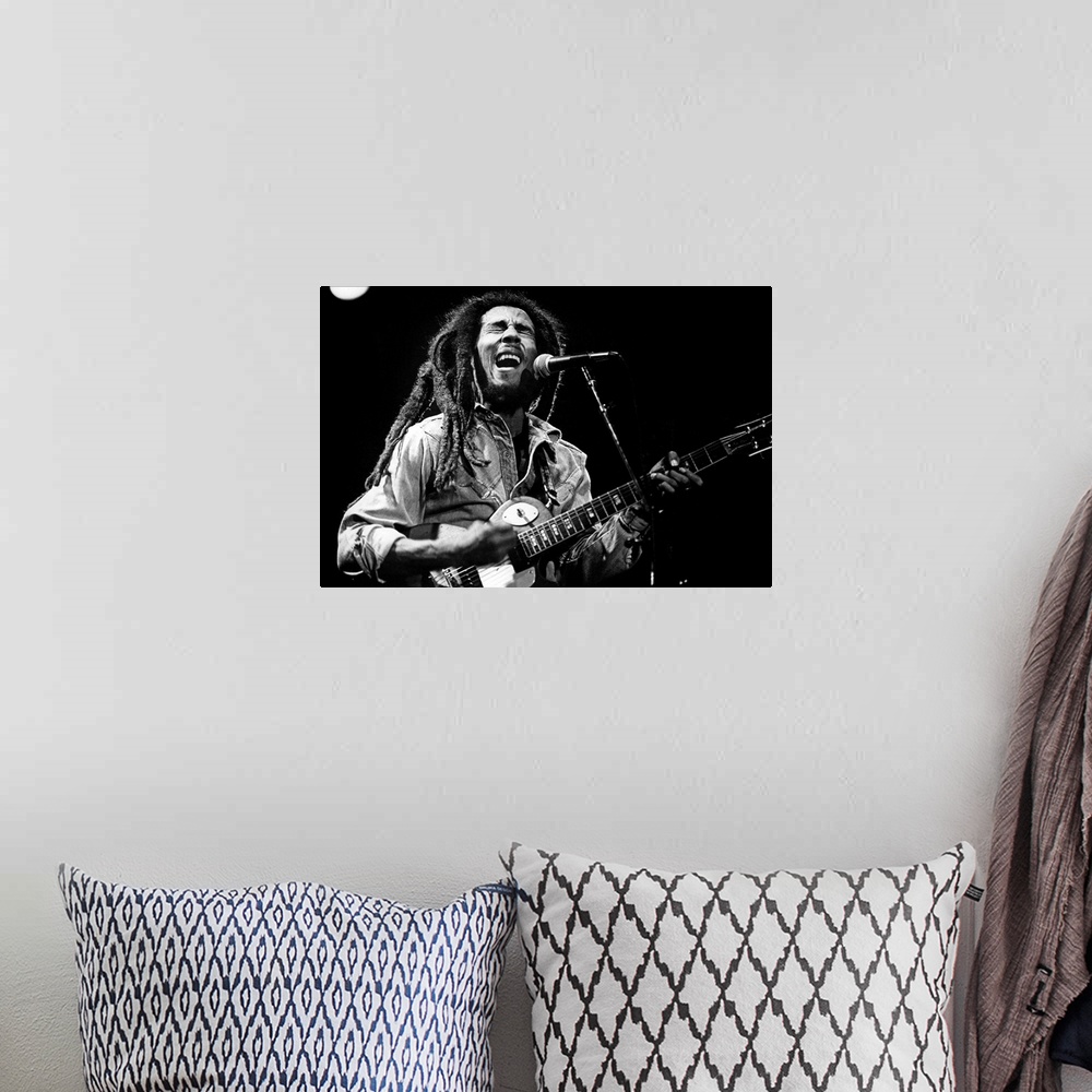 A bohemian room featuring Bob Marley on stage in 1976