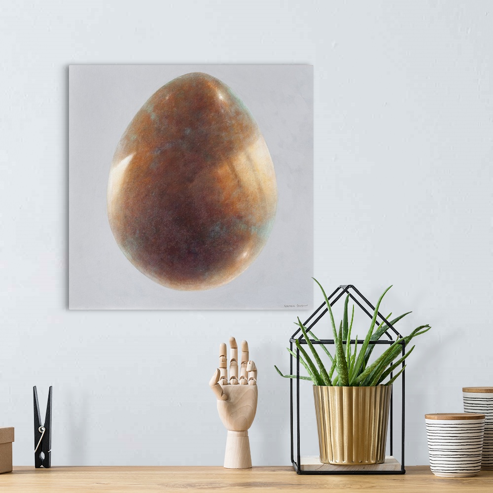 A bohemian room featuring Contemporary painting of a bronze egg against a light gray background.