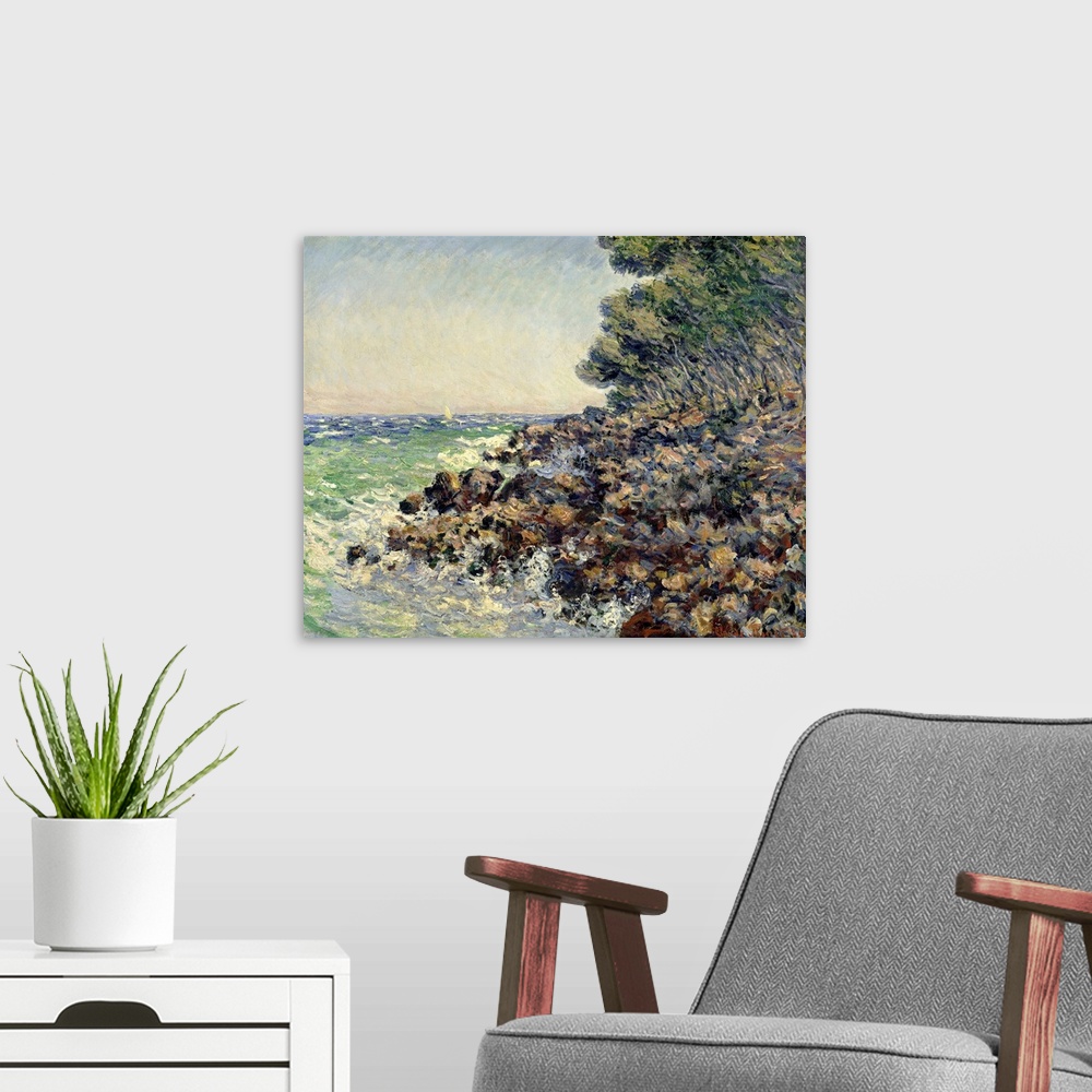 A modern room featuring Impressionist oil painting by Claude Monet of a rocky beach shore overlooking the ocean.