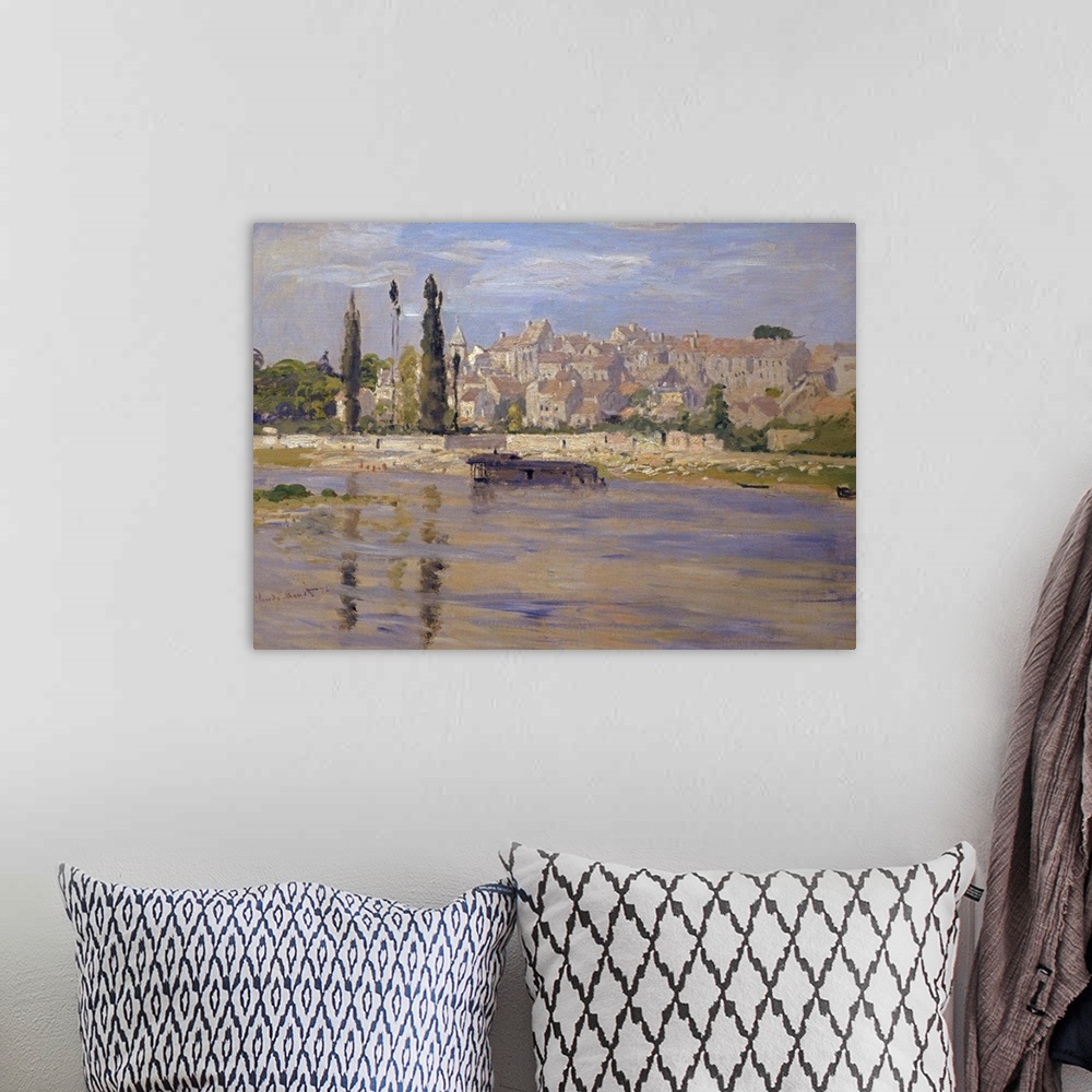 A bohemian room featuring Oversized, landscape, classic art painting of a body of water in the foreground, a city with many...