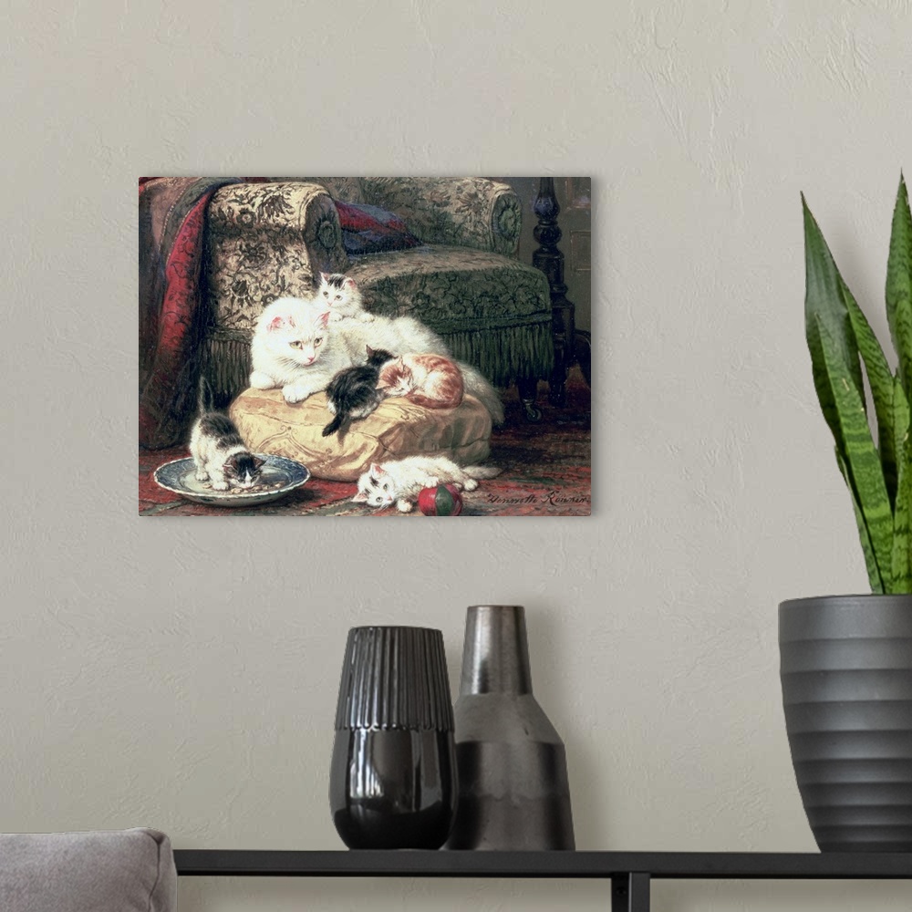 A modern room featuring Cat with her Kittens on a Cushion