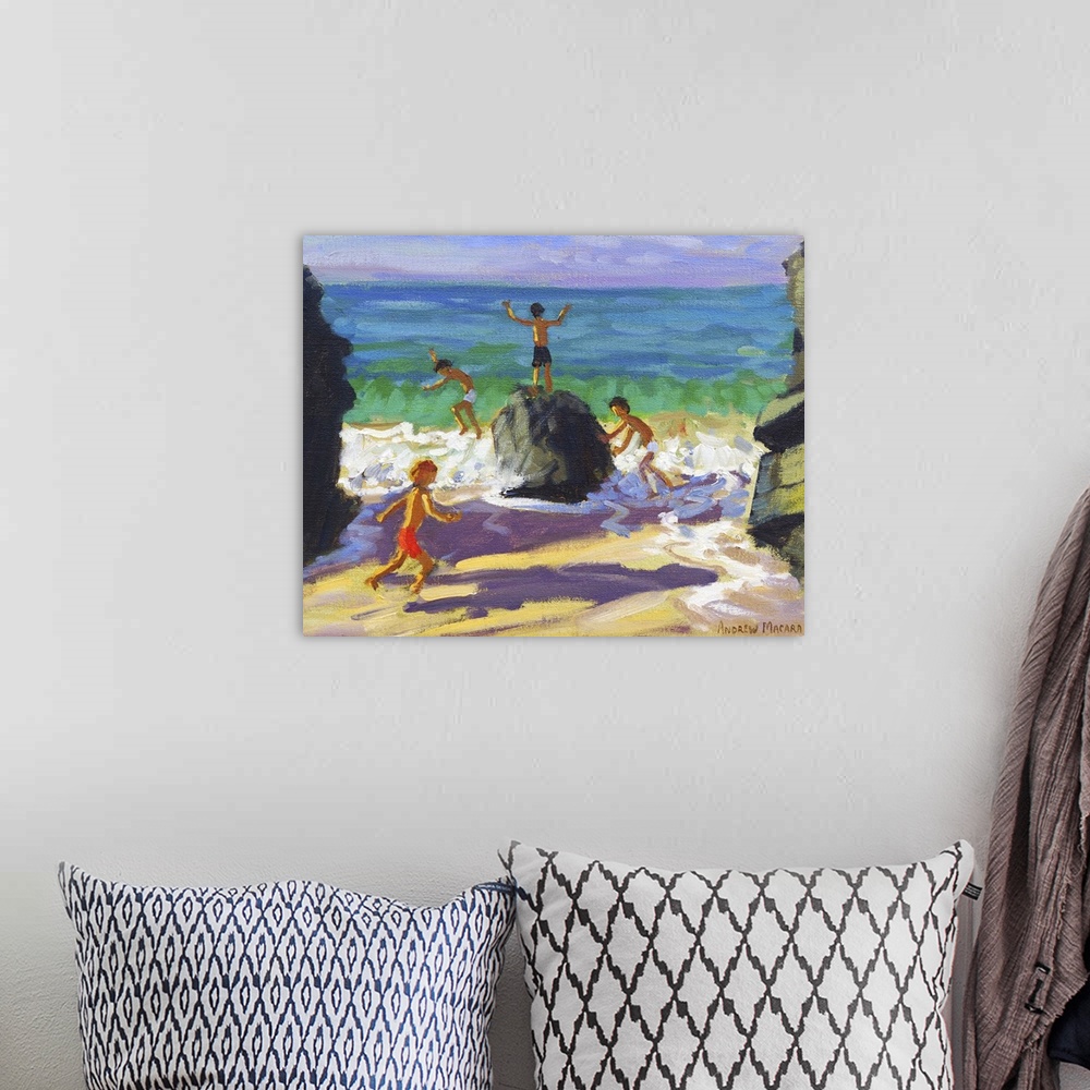 A bohemian room featuring Contemporary painting of children playing on rocks on a beach.