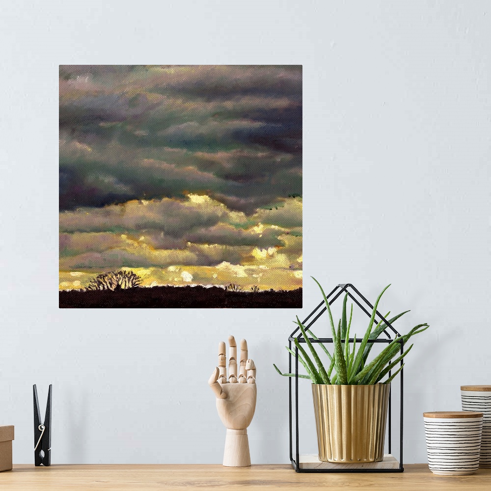 A bohemian room featuring Contemporary painting of a sky with layers of ominous looking clouds.