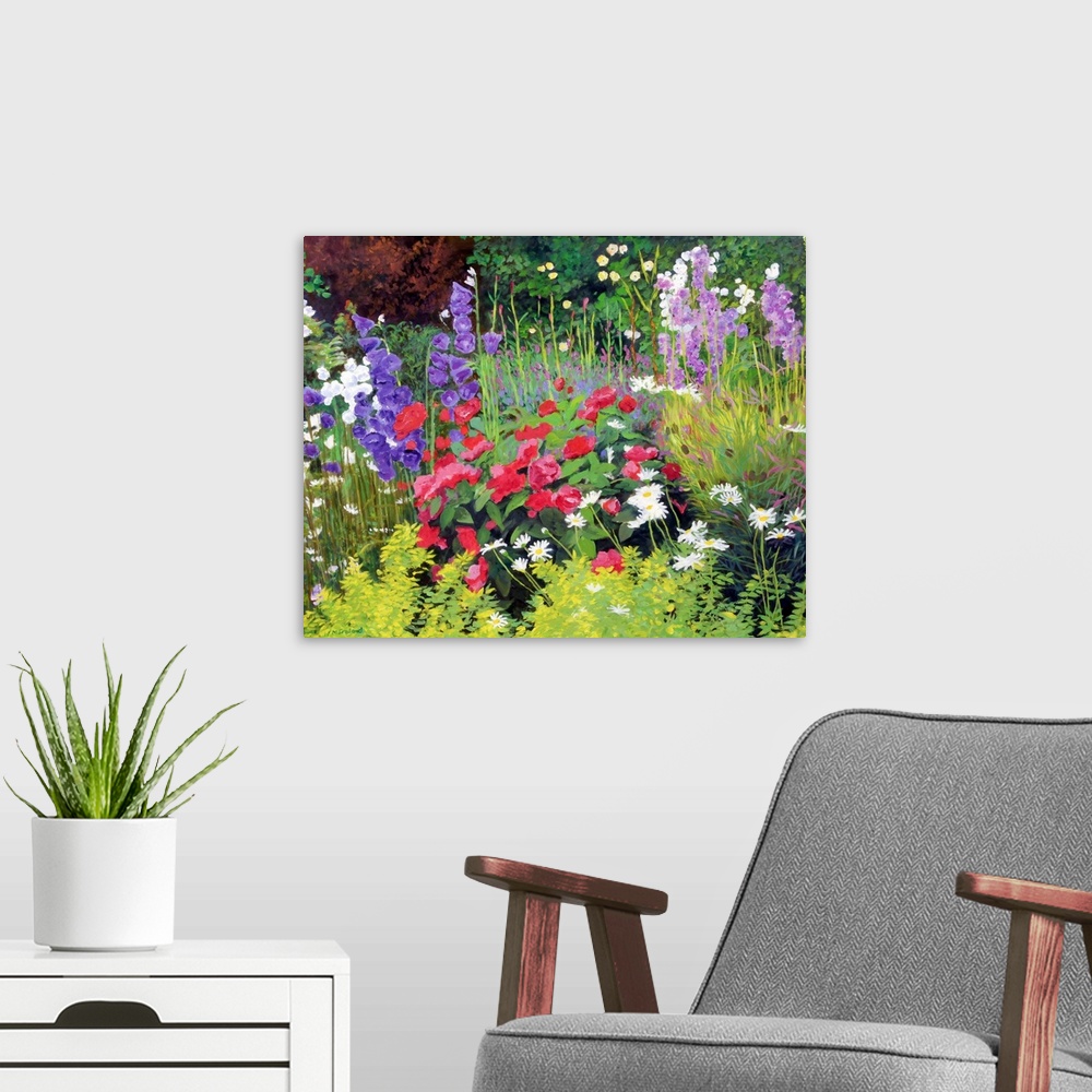A modern room featuring Horizontal , floral painting of many types of colorful, blooming flowers in a flower garden, surr...