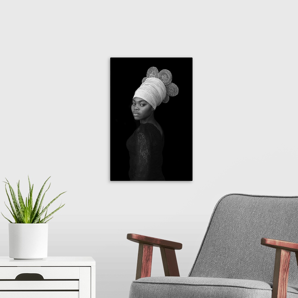 A modern room featuring A stunning contemporary black and white portrait of a young Black woman wearing an elaborate wrap...