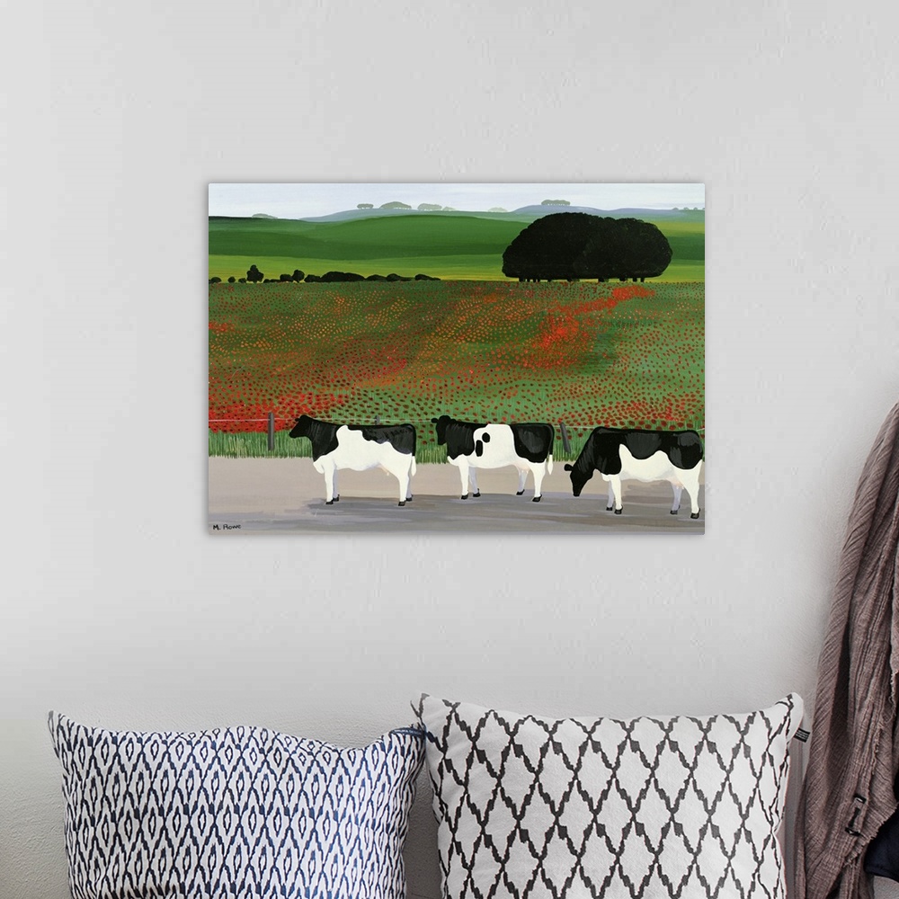 A bohemian room featuring Large artwork on a horizontal canvas of three cows standing in front of a fenced off field of pop...