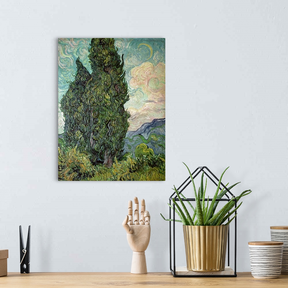 A bohemian room featuring Oil painting of huge tree with mountains and clouds in the distance.  The painting consists of sw...