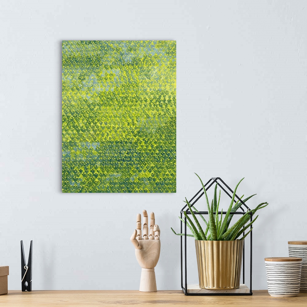 A bohemian room featuring Contemporary pattern painting using yellows and greens.