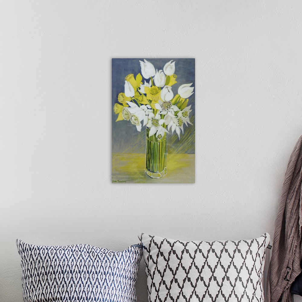 A bohemian room featuring Daffodils and white tulips in an octagonal glass vase
