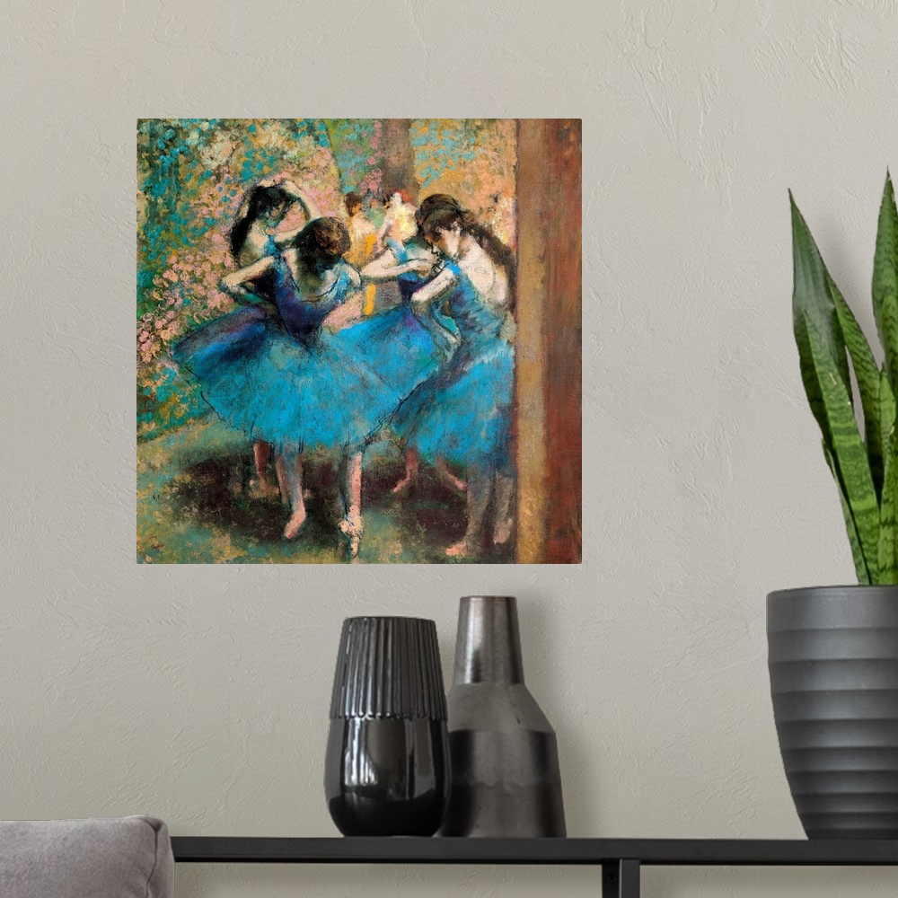 A modern room featuring Edgar Degas' famous painting of four ballerinas practicing in the foreground with other figures v...