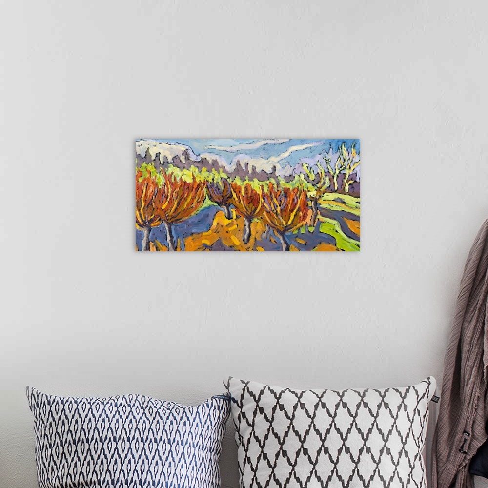 A bohemian room featuring An abstract artwork piece of willow trees in a field. Various colors are used and applied in wave...