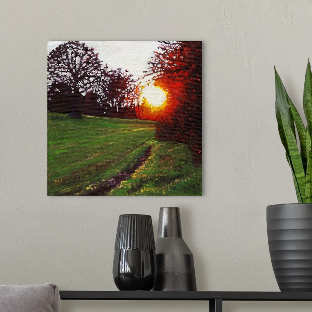 A modern room featuring Contemporary painting of a forest clearing in a countryside scene with a setting sun seen through...