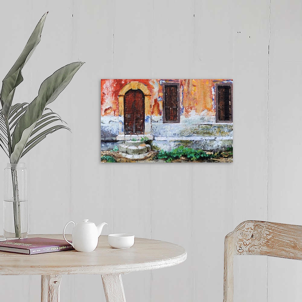 A farmhouse room featuring Realistic painting of the side of a weathered building in Greece with an arched door and two shut...