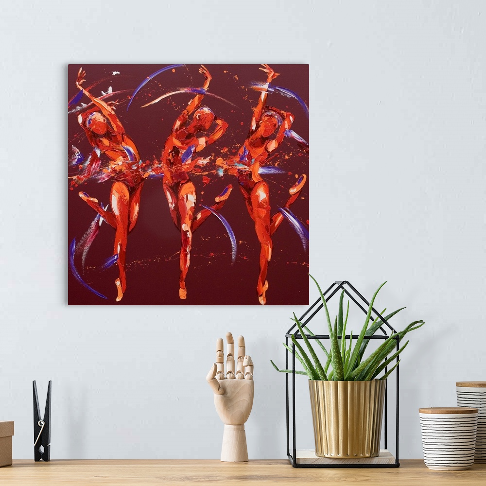 A bohemian room featuring Contemporary painting using deep warm colors to create three women dancing against a dark red bac...