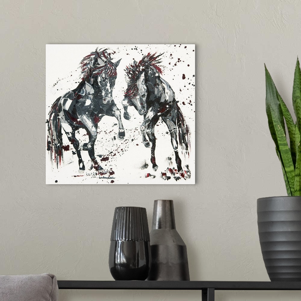 A modern room featuring Contemporary painting of two leaping horses in shades of black with red.