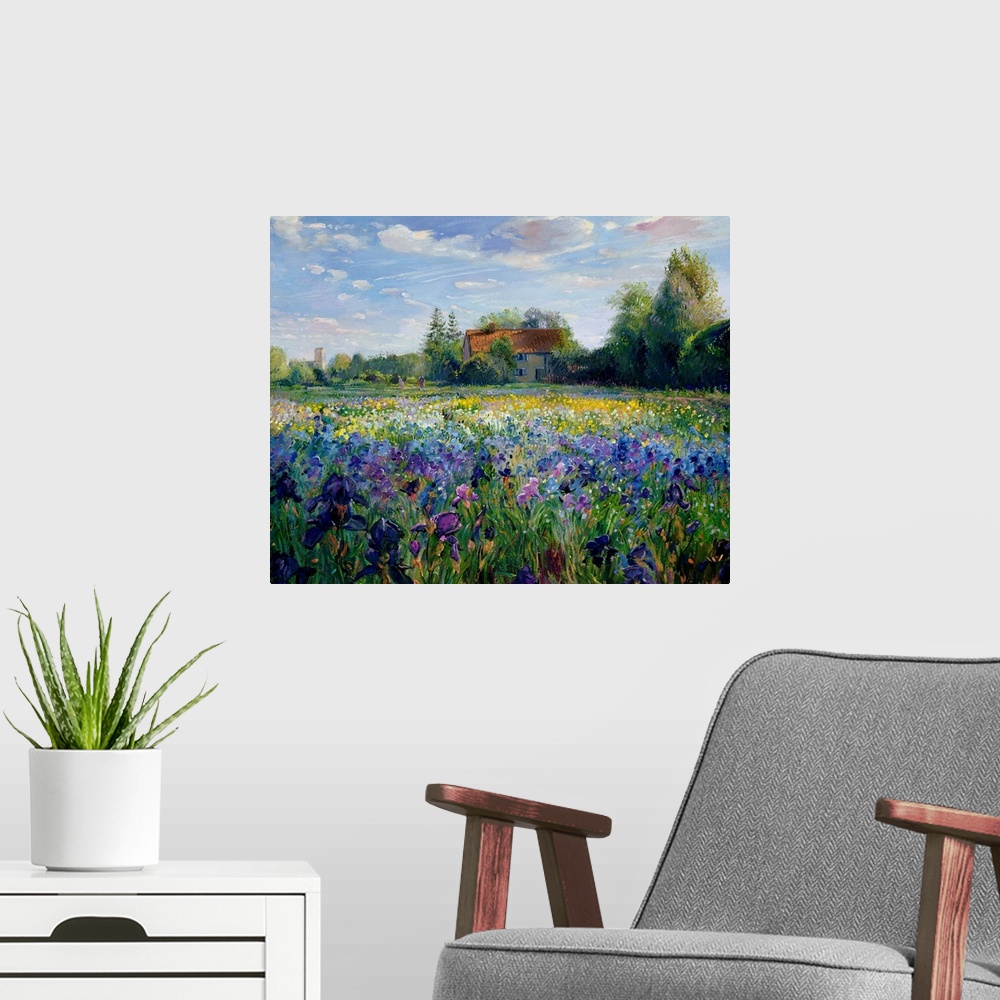 A modern room featuring Painting of house surrounded by trees with forest in the background and colorful flower meadow in...