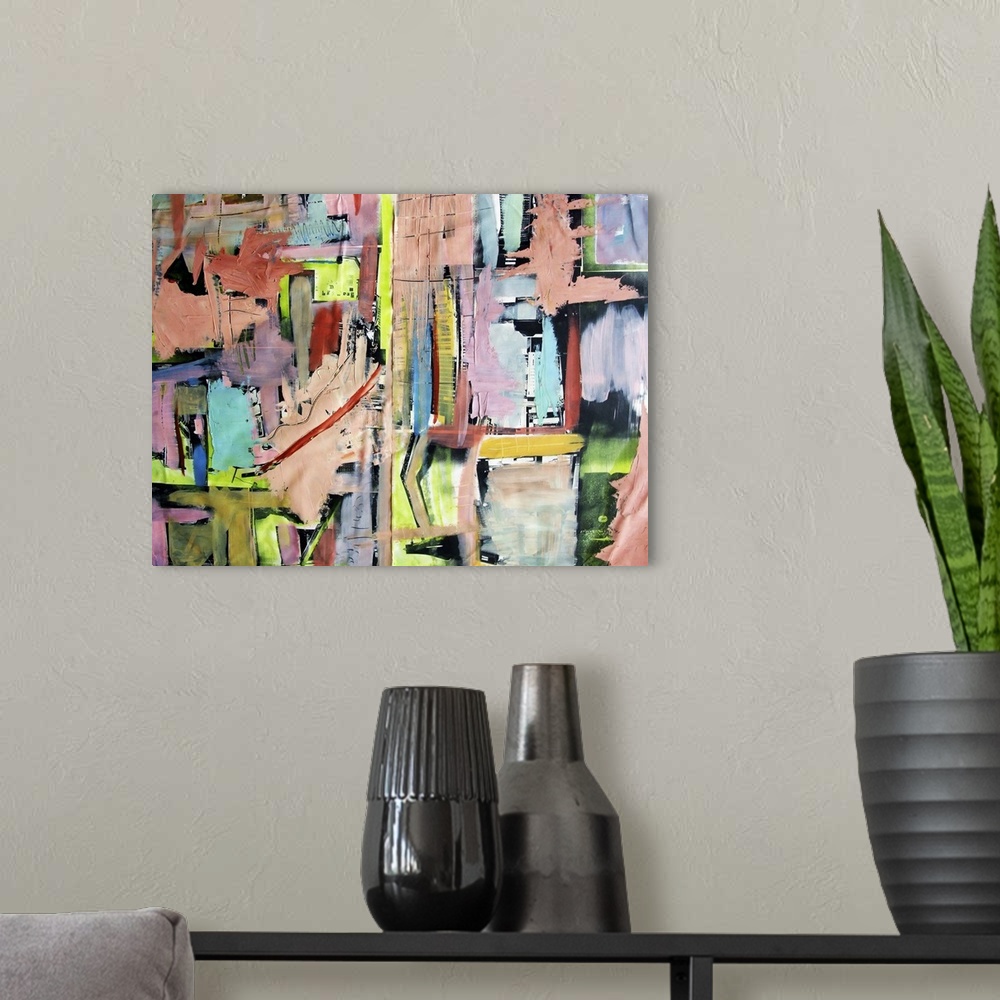 A modern room featuring Contemporary abstract painting using bright vivid colors and strong geometric shapes.