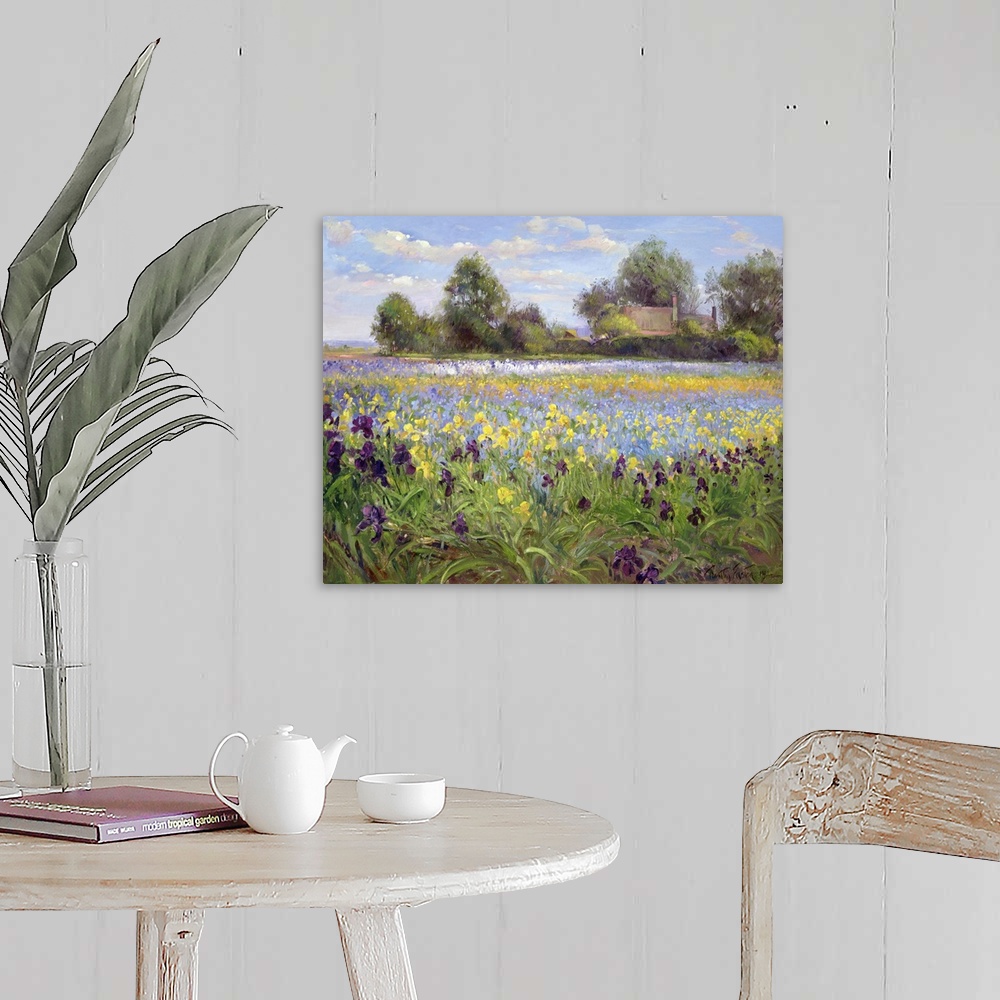 A farmhouse room featuring Painting on canvas of a field of wildflowers with a house and trees in the distance.
