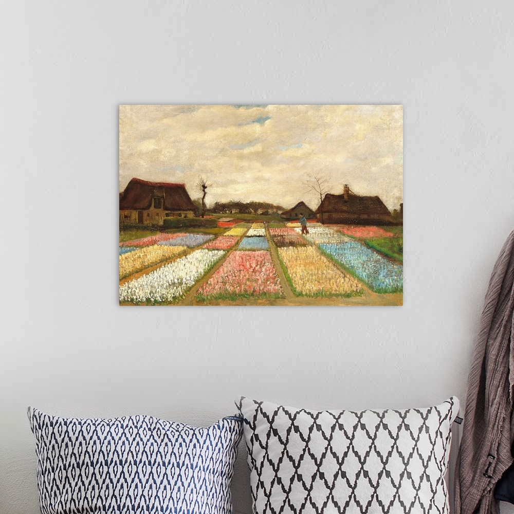 A bohemian room featuring Landscape painting by Vincent Van Gogh of flower beds in Holland.