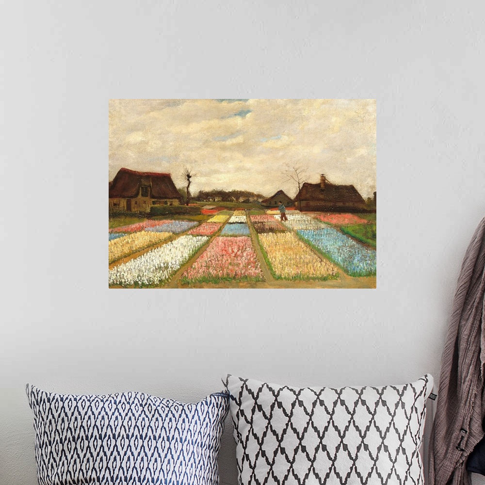 A bohemian room featuring Landscape painting by Vincent Van Gogh of flower beds in Holland.