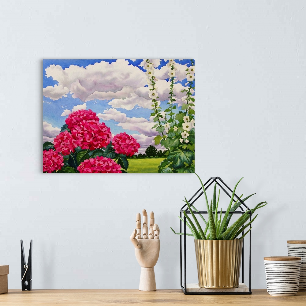 A bohemian room featuring Contemporary painting of hollyhocks in a field under a cloudy sky.
