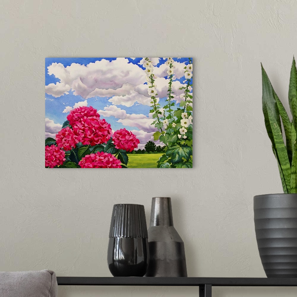 A modern room featuring Contemporary painting of hollyhocks in a field under a cloudy sky.