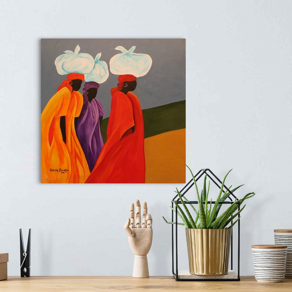 A bohemian room featuring Contemporary painting of Haitian women with tied bundles on their heads.