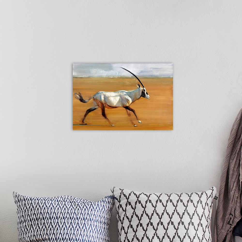 A bohemian room featuring Contemporary wildlife painting of an Oryx running in the desert.