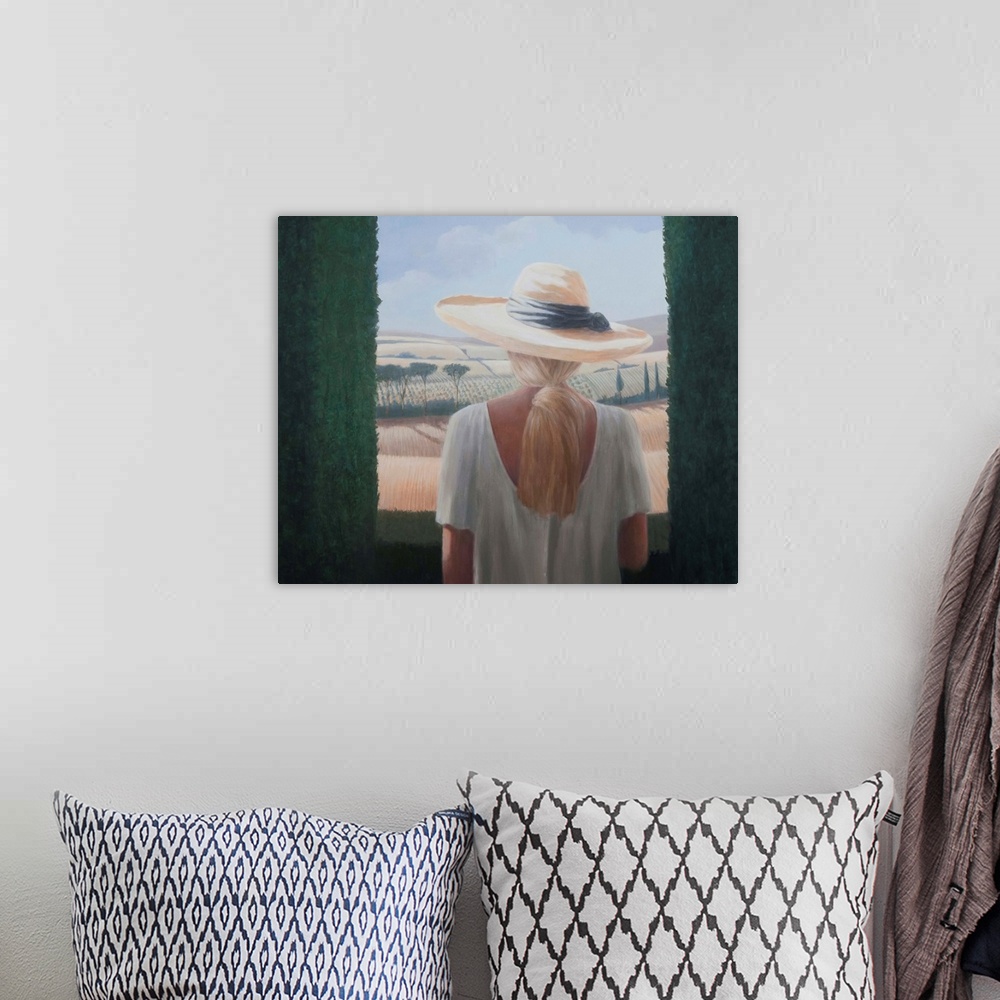 A bohemian room featuring Contemporary painting of a woman with a sun hat, looking out a window.