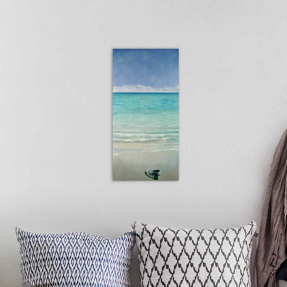A bohemian room featuring Large vertical painting of a single pair of tennis shoes sitting on a sandy beach as clear blue w...